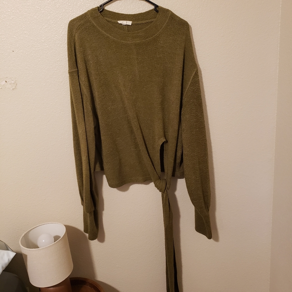 Green easel tie sweater